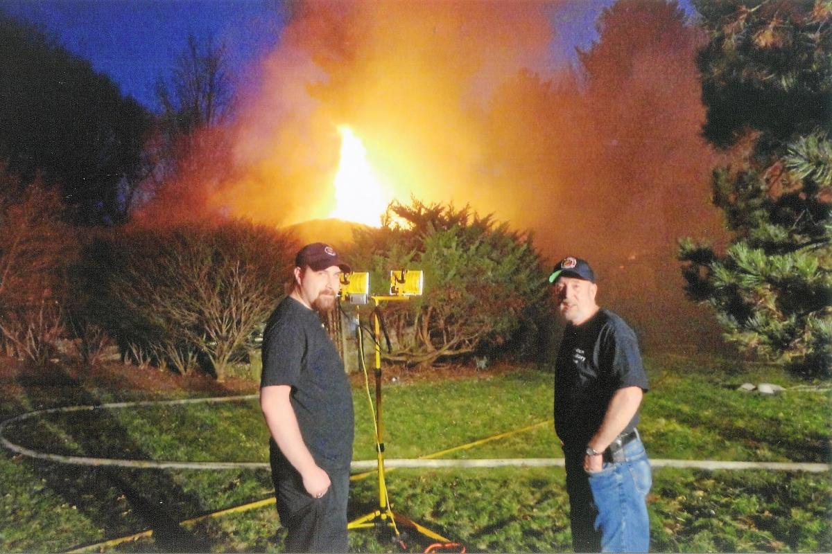 Two Men with a Fire in the Background